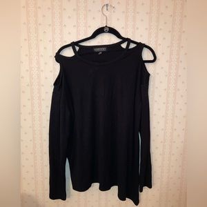 Cute asymmetrical black top with shoulder cutouts! In size medium